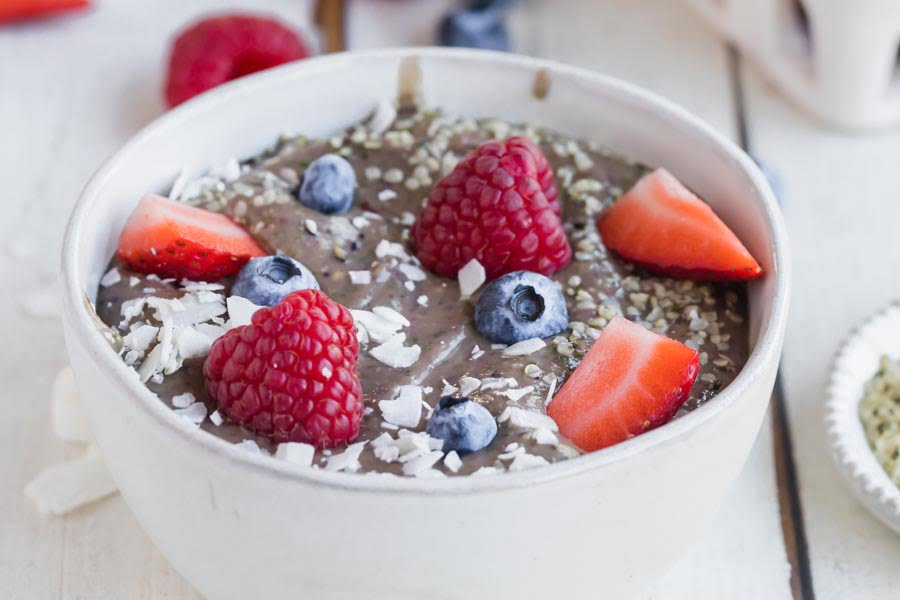 This is an image of the Creamy Avocado and Spinach Smoothie Bowl meal.